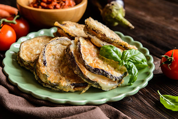 istock Eggplant stuffed with Mozzarella, served with tomato salsa 612749778