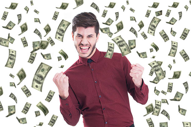 istock Happy man and falling down dollar bills banknotes 612749806