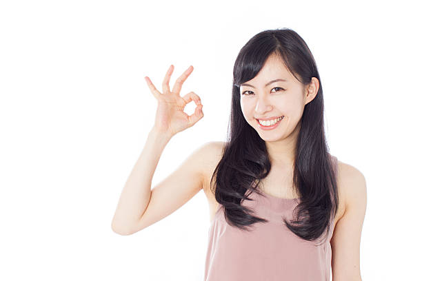 istock Japanese woman in white background making gestures 612749830