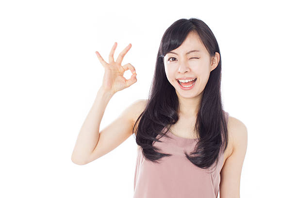 istock Japanese woman in white background making gestures 612749864
