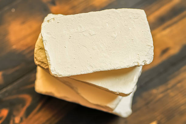 istock Soap on wooden floor 612750356