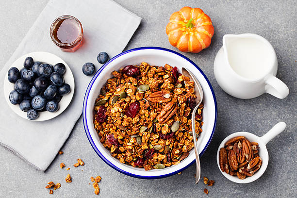 istock Healthy breakfast. Fresh granola, muesli with pumpkin, pecans, maple syrup 612750784