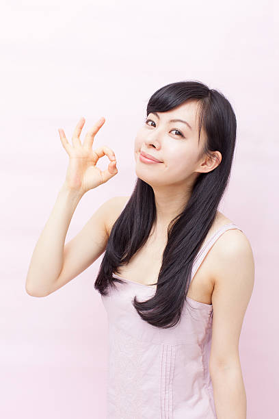istock Japanese woman making gestures 612752060