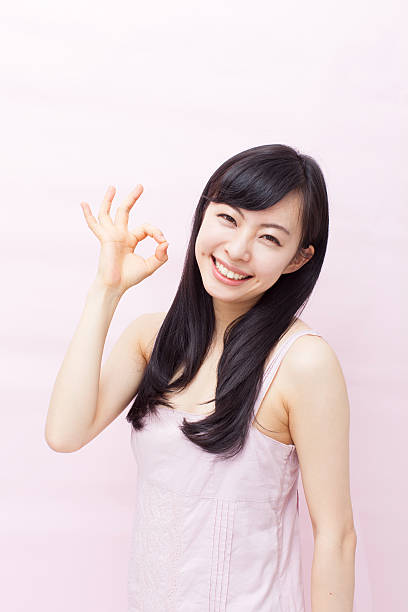istock Japanese woman making gestures 612752084