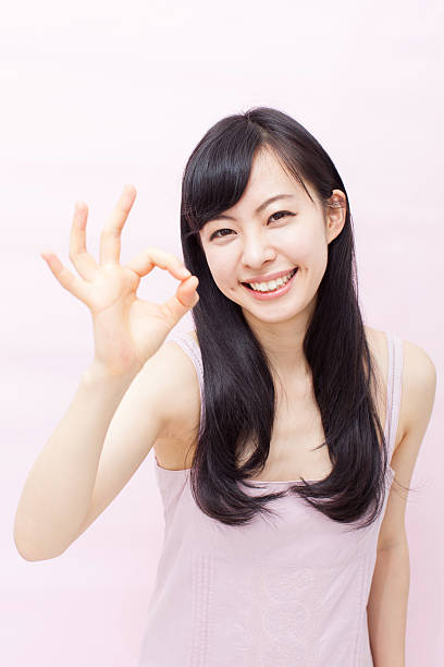 istock Japanese woman making gestures 612752110