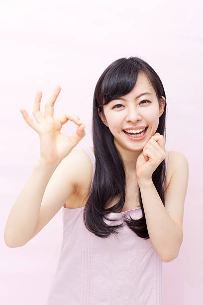 istock Japanese woman making gestures 612752154