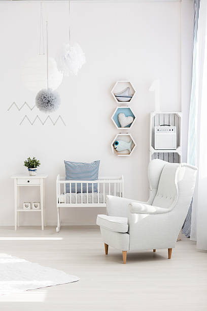 istock Armchair in baby room 612752896