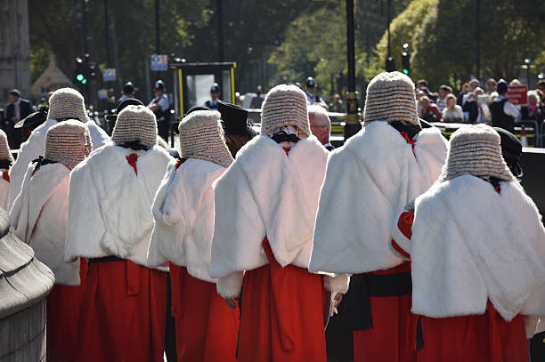 London, UK - October 3rd 2016: High cout judges in full bottom wigs and ceremonial robes during a procession at Westminster at the start of the legal year