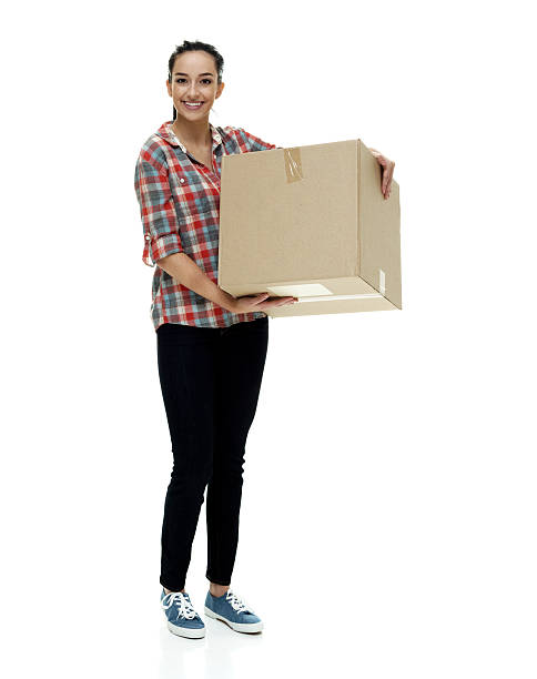 istock Cheerful female holding box 612754376