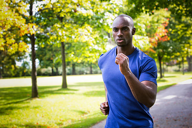 istock young man running outdoors 612758434