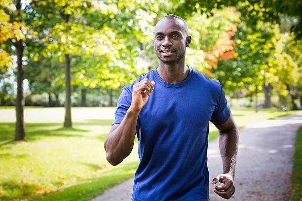 istock young man running outdoors 612758462