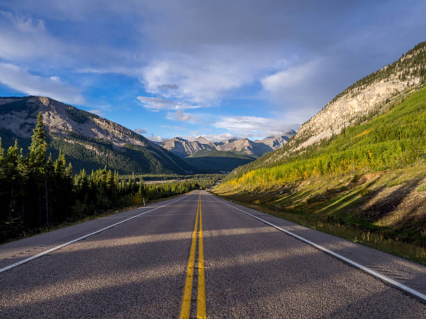 istock road through Rocky Mountains 612758586