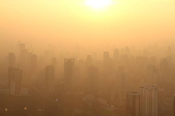 Aerial view of big city at misty sunrise, Bangkok, Thailand stock photo