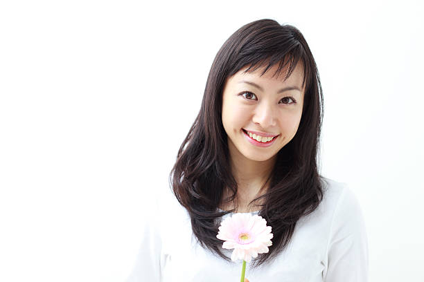 istock Japanese woman holding a flower 612816970