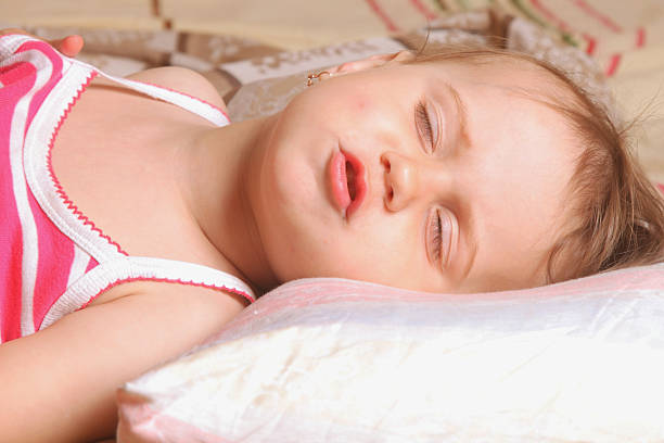 istock Beautiful baby girl is sleeping 612818344