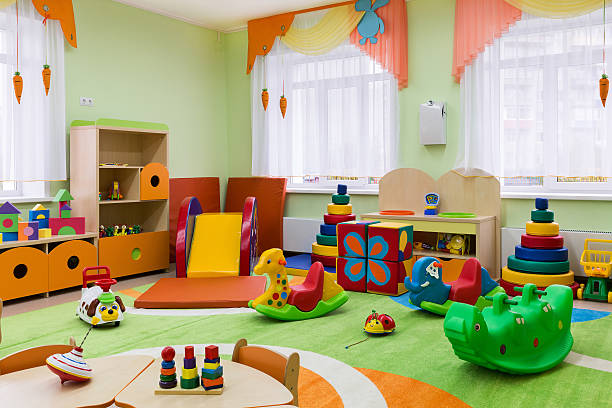 Game room in the kindergarten. The new interior of the playroom for small children. preschool building stock pictures, royalty-free photos & images