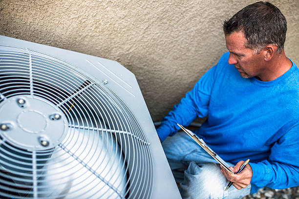 istock Maintenance engineer inspecting outdoor air conditioning unit 612818840