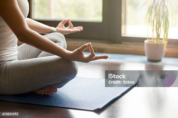 Yoga At Home Meditating Closeup Stock Photo - Download Image Now - Yoga, Domestic Room, Zen-like