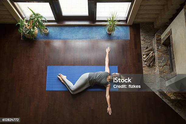 Yoga At Home Belly Twist Pose Stock Photo - Download Image Now - Twisted, Yoga, Lying On Back