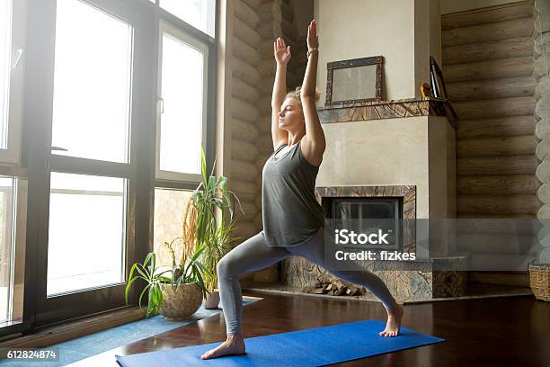 Yoga At Home Virabhadrasana 1 Pose Stock Photo - Download Image Now - Domestic Room, Inside Of, Only Women