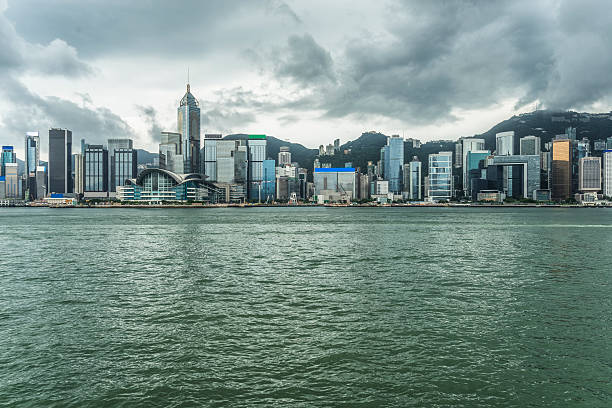 istock Hong Kong victoria skyline against overcast sky 612825610