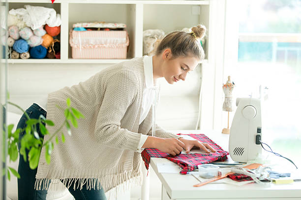 istock Portrait of a woman working with a sewing pattern 612825684