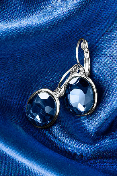 istock Earrings on silk 612826220