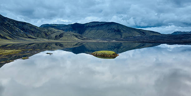 istock Lake coast with mountain reflection, Iceland 612828440