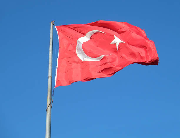istock Turkish flag waving in the blue sky, Istanbul 612830274