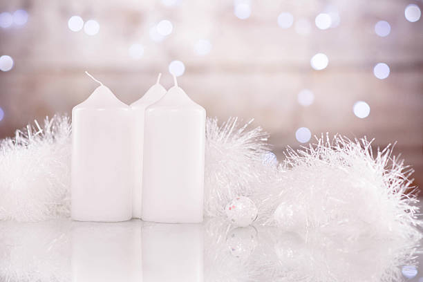 istock Candles surrounded by snowy tinsel 612832854