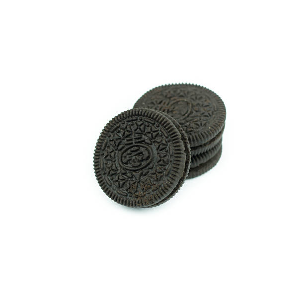 istock Chocolate cookies with creme filing isolated on white 612832932