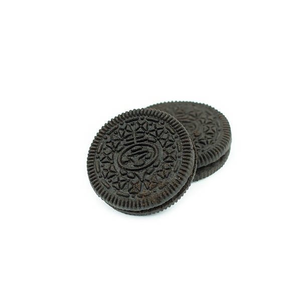 istock Chocolate cookies with creme filing isolated on white 612832960