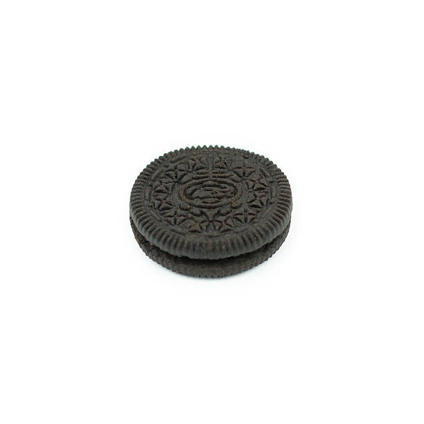 istock Chocolate cookies with creme filing isolated on white 612832992