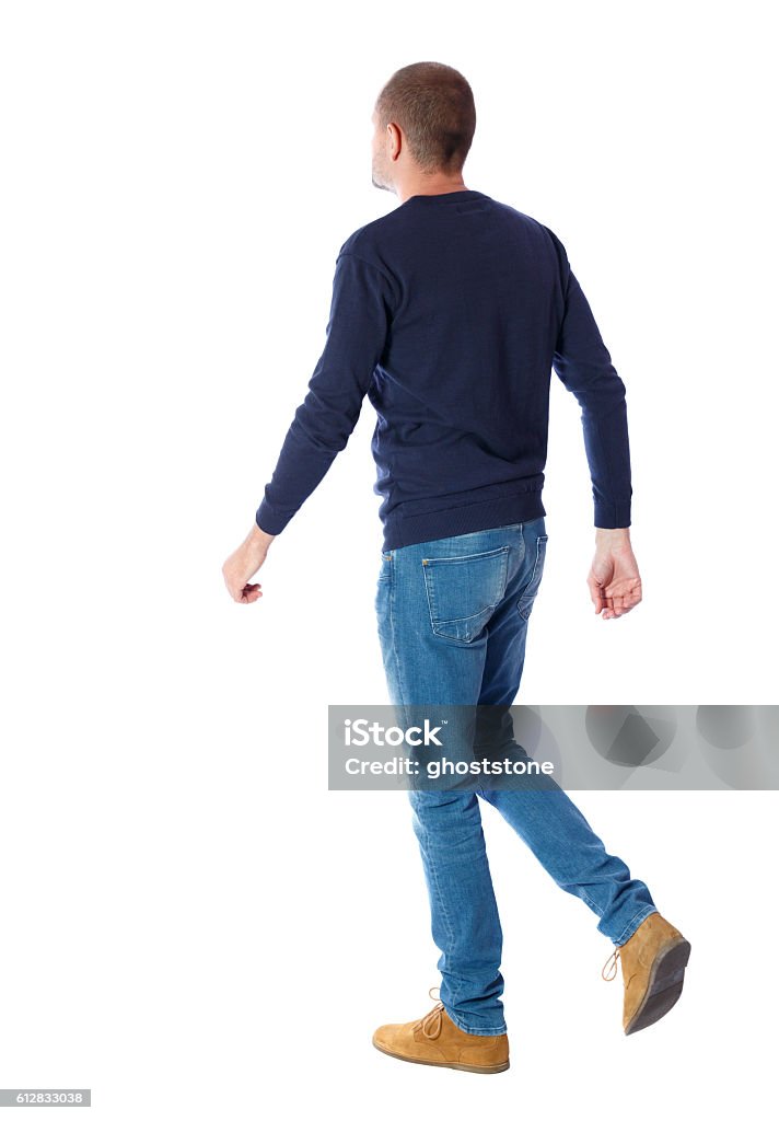 Back view of going  handsome man. Back view of going  handsome man. walking young guy . Rear view people collection.  backside view of person.  Isolated over white background. A guy in a black sweater passes. People Stock Photo