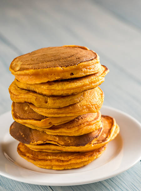 istock Stack of pumpkin pancakes on the plate 612833838