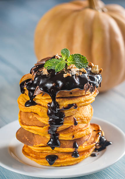 istock Pumpkin pancakes with chocolate topping 612833886