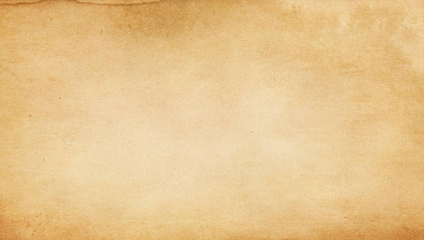 istock Old stained and yellowed paper texture. 612834376