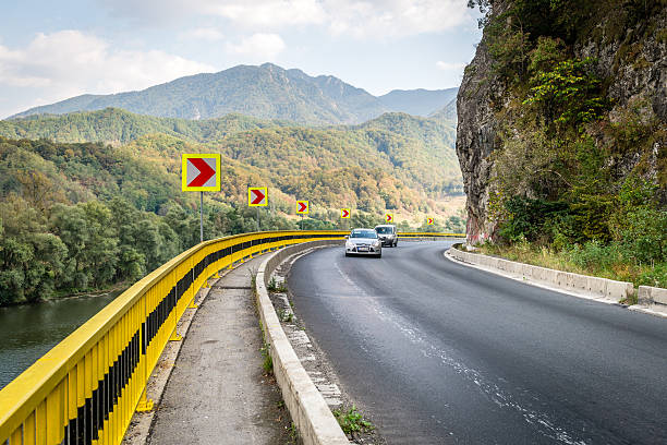 Transilvania, Romania - September 16, 2016: Cars are driving on mountain road in Romania