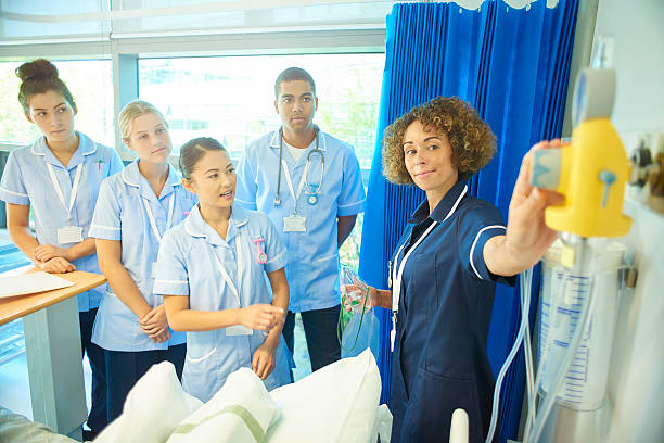istock young nurse asks her ward nurse sister questions 612834676