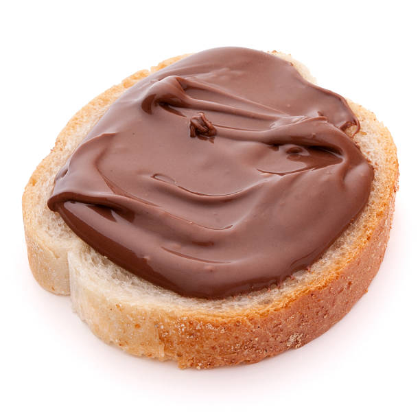 istock Bread with chocolate cream isolated on white background cutout 612836374