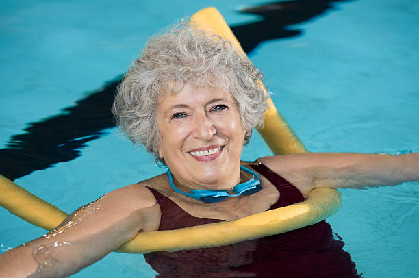 istock Senior woman swim 612838772