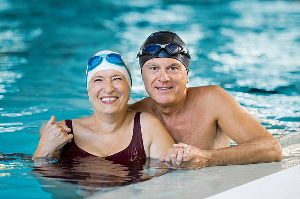 istock Senior couple in pool 612839316