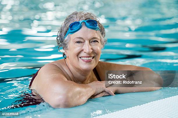 Elderly Woman In Pool Stock Photo - Download Image Now - Senior Adult, Swimming, Exercising