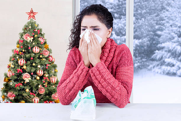 istock Woman sneezing with influenza symptom 612839800