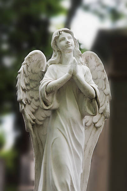 istock Vintage image of a sad angel on a cemetery 612839934