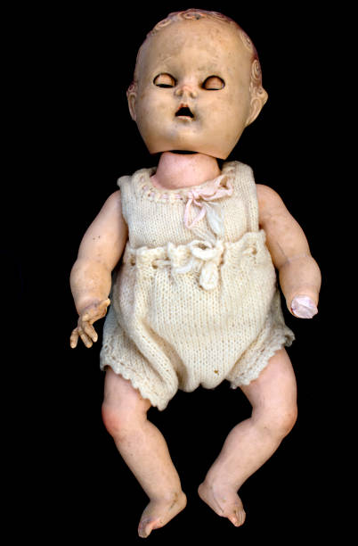 istock Close Up and Isolated Vintage Antique Old Doll 612842604