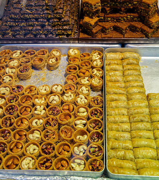 istock Delicious Turkish sweets and baklava in shop. 612842972