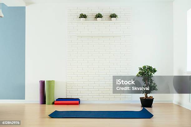 Yoga Room With Mat And White Brick Wall Stock Photo - Download Image Now - Exercise Mat, Exercise Room, No People