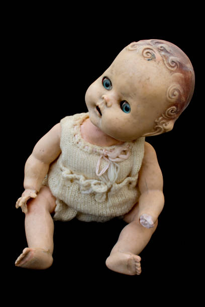 istock Close Up and Isolated Vintage Antique Old Doll 612843326
