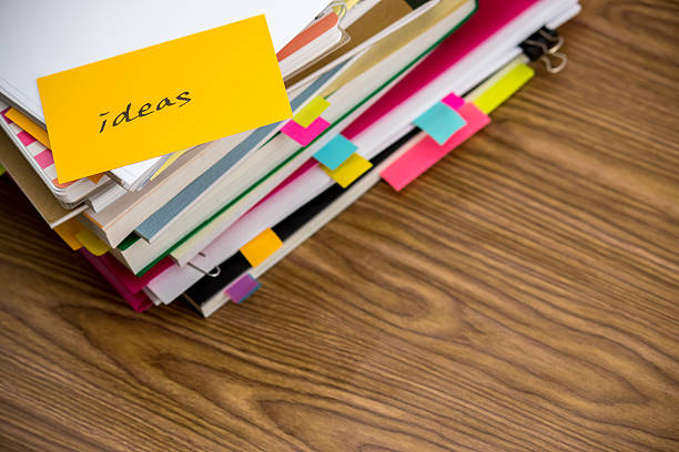 istock Ideas; The Pile of Business Documents on the Desk 612845176